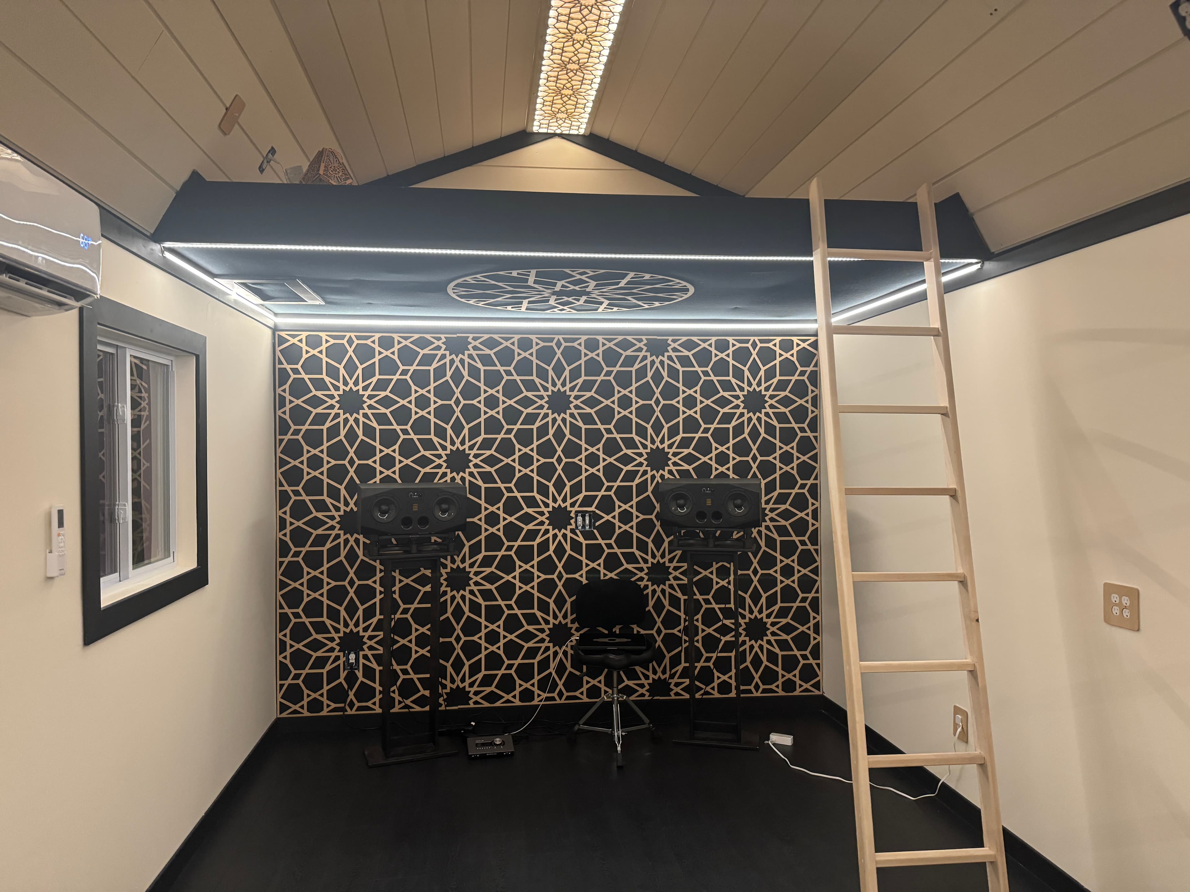 Custom CNC geometric wall installation in a studio